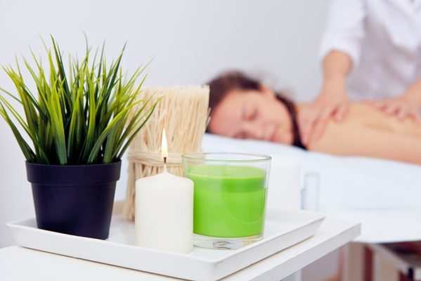 Beautiful young woman relaxing at beauty spa day spa insurance | sparrow insurance